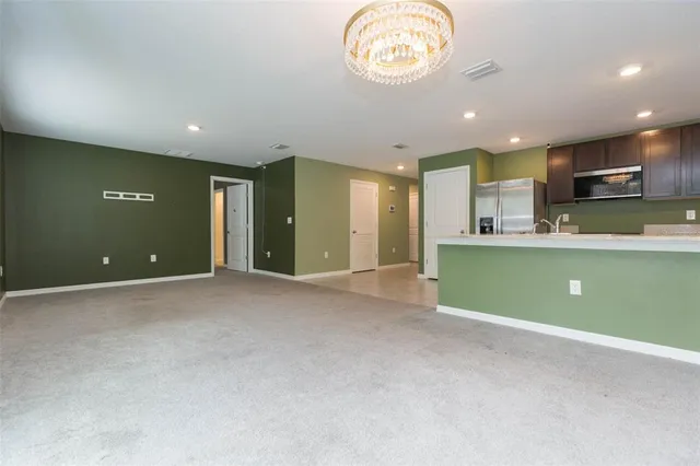 a view of a kitchen with a sink and a microwave