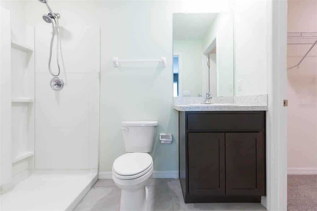 5358 Woodridge Lane Spring Hill, FL 34609 - Photo 27 of 32 a bathroom with a sink a toilet and shower