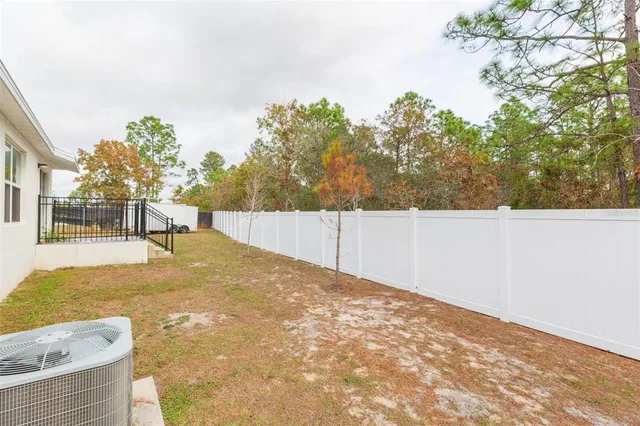 a house view with a backyard space