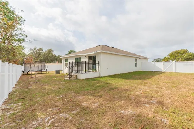 a view of a yard with swimming pool