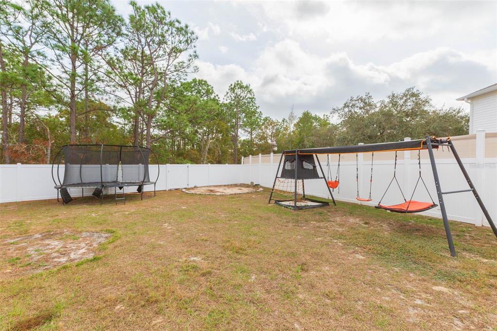 5358 Woodridge Lane Spring Hill, FL 34609 - Photo 32 of 32 a view of a yard with swimming pool