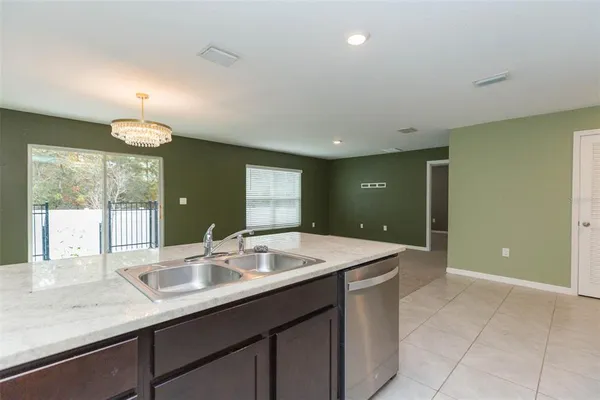 a bathroom with a sink vanity and mirror