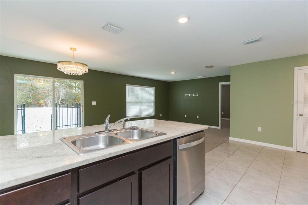 5358 Woodridge Lane Spring Hill, FL 34609 - Photo 7 of 32 a bathroom with a sink vanity and mirror