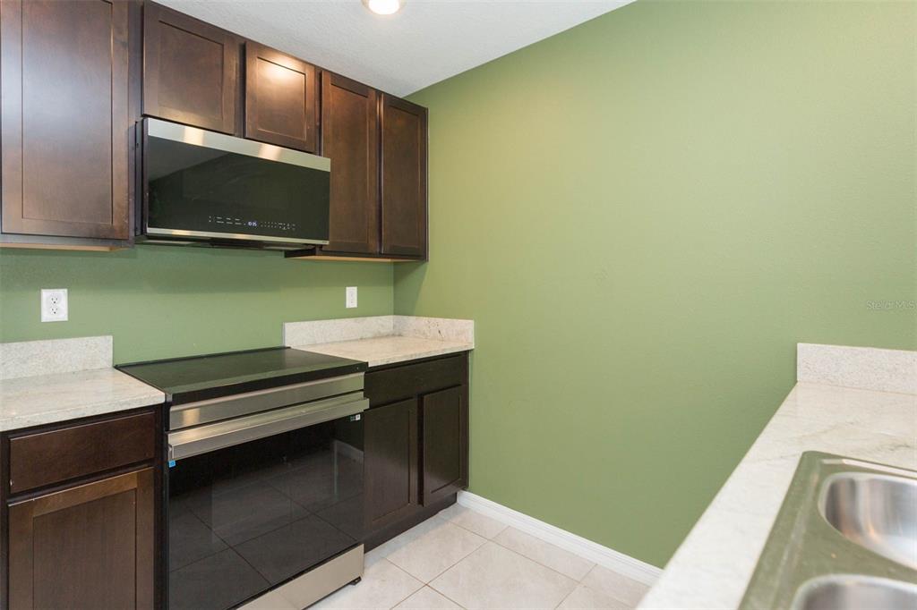 5358 Woodridge Lane Spring Hill, FL 34609 - Photo 8 of 32 a bathroom with a sink and a mirror