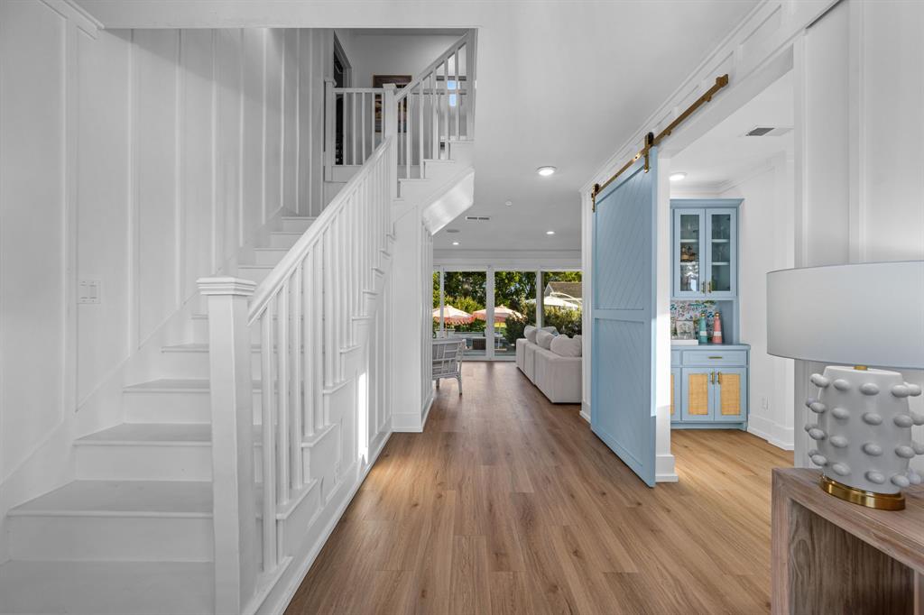 533 Camp Creek Road Rockwall, TX 75087 - Photo 6 of 40 a view of a hallway view with wooden floor and staircase