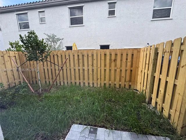 a view of a wooden fence
