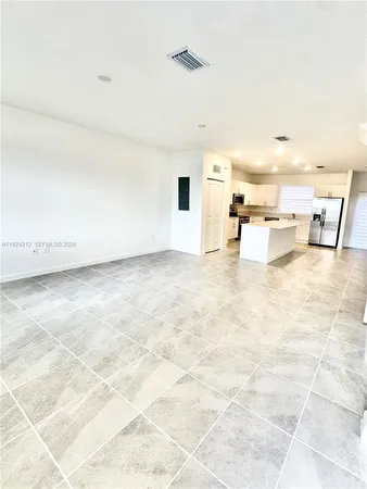 a view of a living room and kitchen