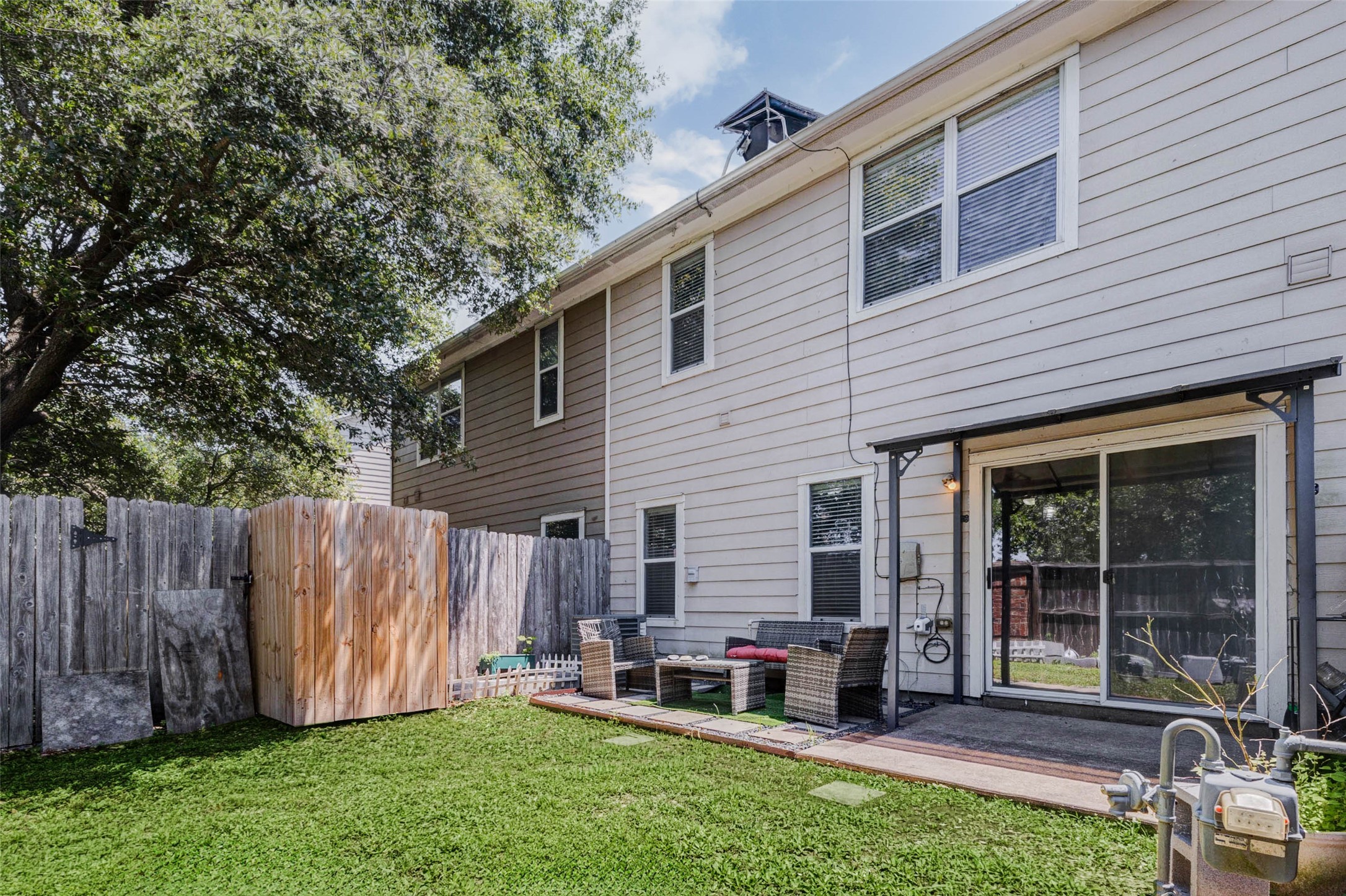 14522 Durham Chase Lane Houston, TX 77095 - Photo 32 of 40 a view of backyard with table and chairs and a large tree