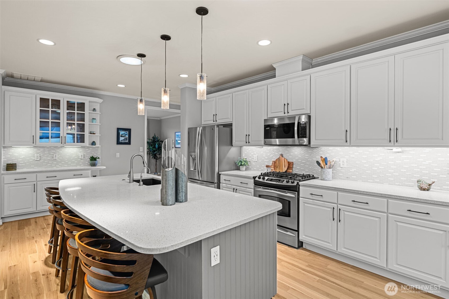 12735 Sun Break Way Northeast Redmond, WA 98053 - Photo 12 of 37 a kitchen with a sink a stove a refrigerator and white cabinets