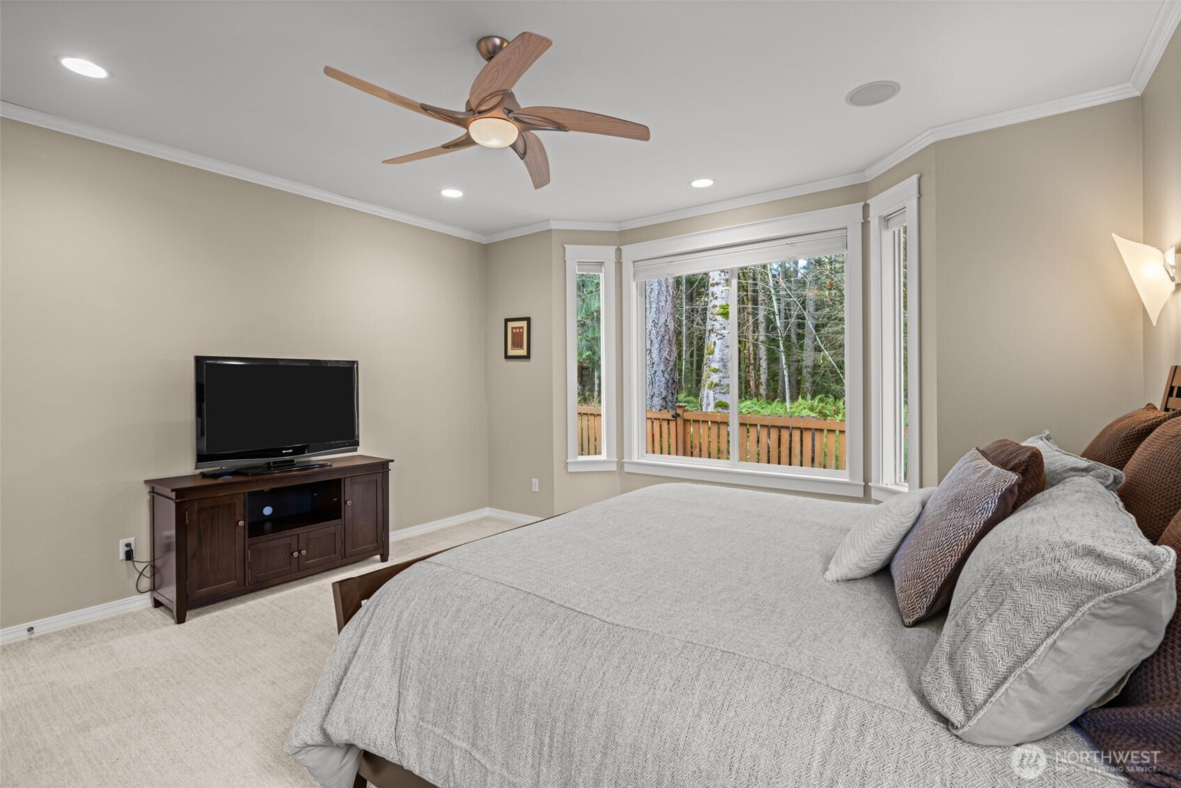12735 Sun Break Way Northeast Redmond, WA 98053 - Photo 15 of 37 a bedroom with a bed and a flat screen tv