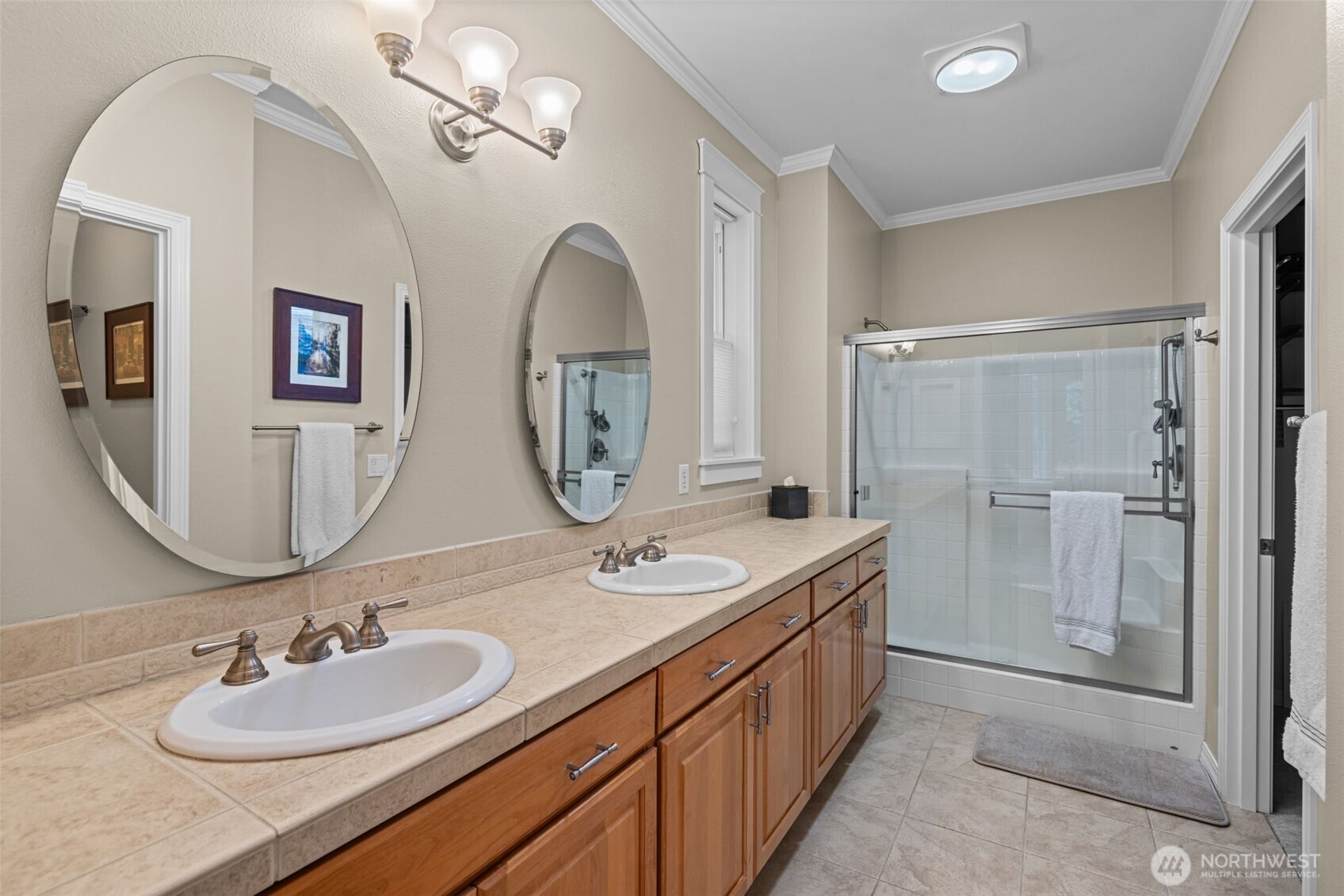 12735 Sun Break Way Northeast Redmond, WA 98053 - Photo 16 of 37 a bathroom with 2 sink and a mirror
