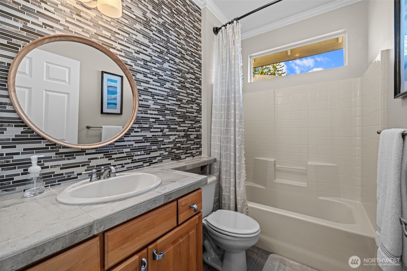 12735 Sun Break Way Northeast Redmond, WA 98053 - Photo 19 of 37 a bathroom with a sink and a mirror