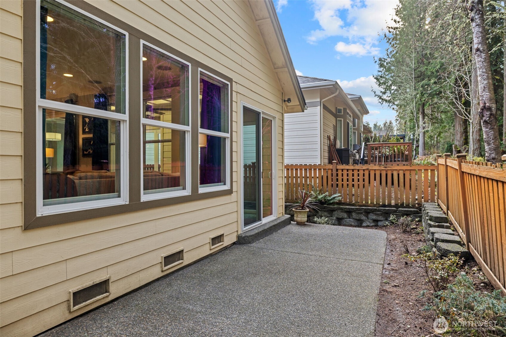 12735 Sun Break Way Northeast Redmond, WA 98053 - Photo 29 of 37 a view of a house with a small yard and wooden floor and fence