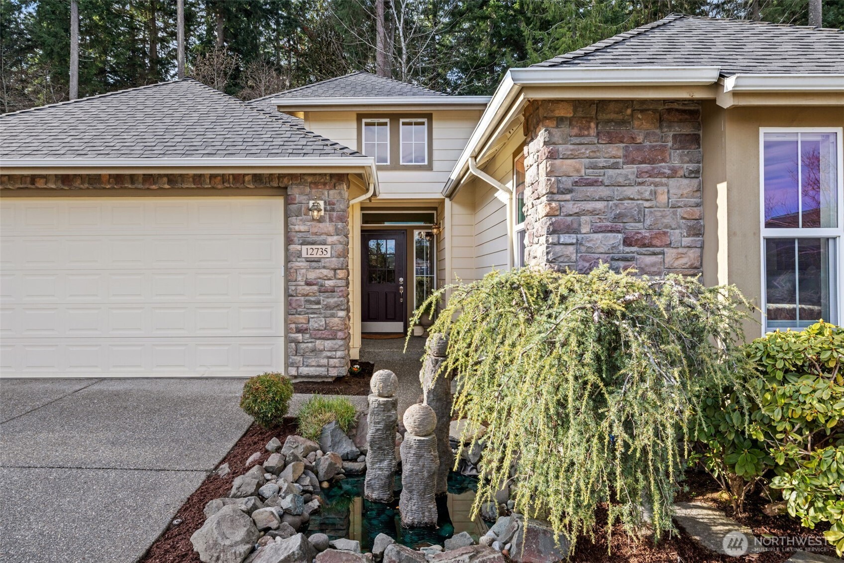 12735 Sun Break Way Northeast Redmond, WA 98053 - Photo 3 of 37 a view of a house with fountain