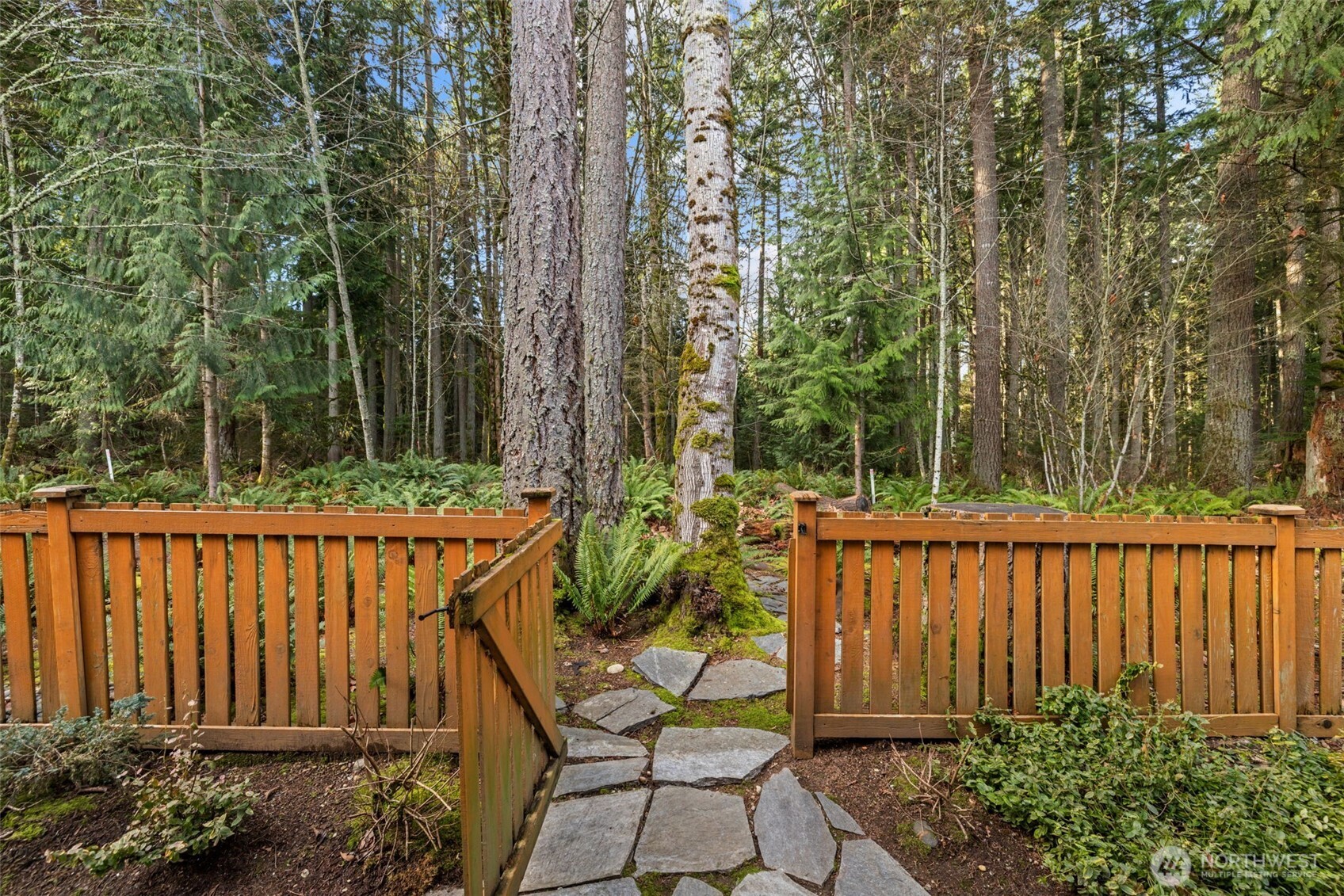 12735 Sun Break Way Northeast Redmond, WA 98053 - Photo 31 of 37 a view of a chair and table in the garden