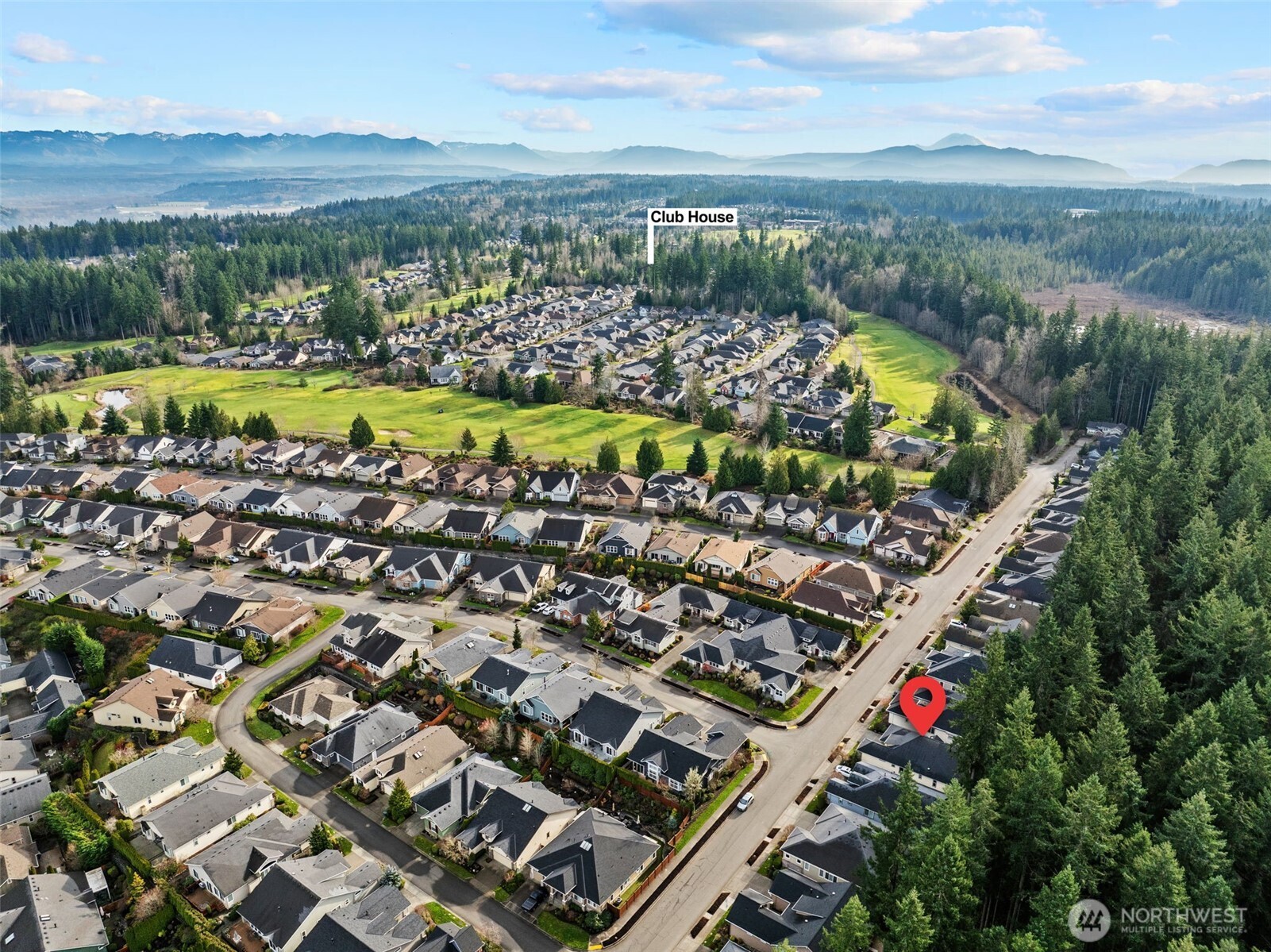 12735 Sun Break Way Northeast Redmond, WA 98053 - Photo 35 of 37 a view of a city with mountains in the background