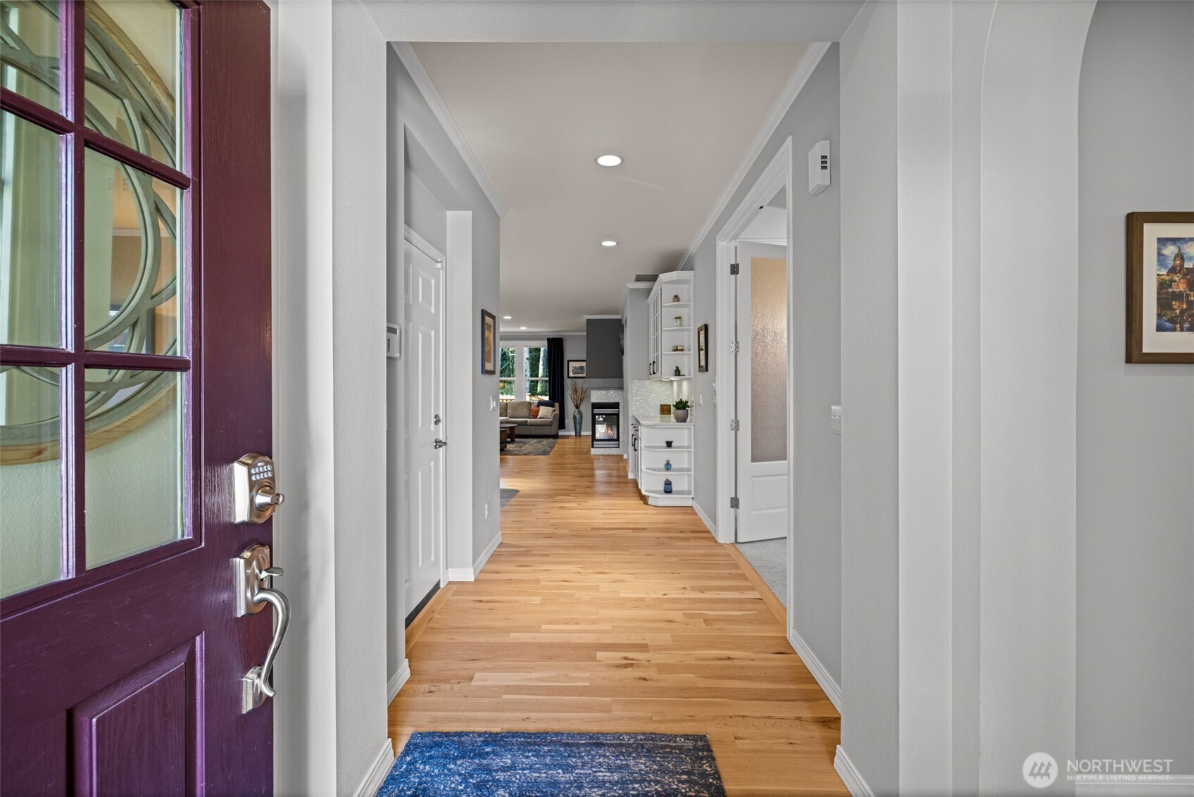 12735 Sun Break Way Northeast Redmond, WA 98053 - Photo 5 of 37 a view of a hallway with wooden floor and staircase