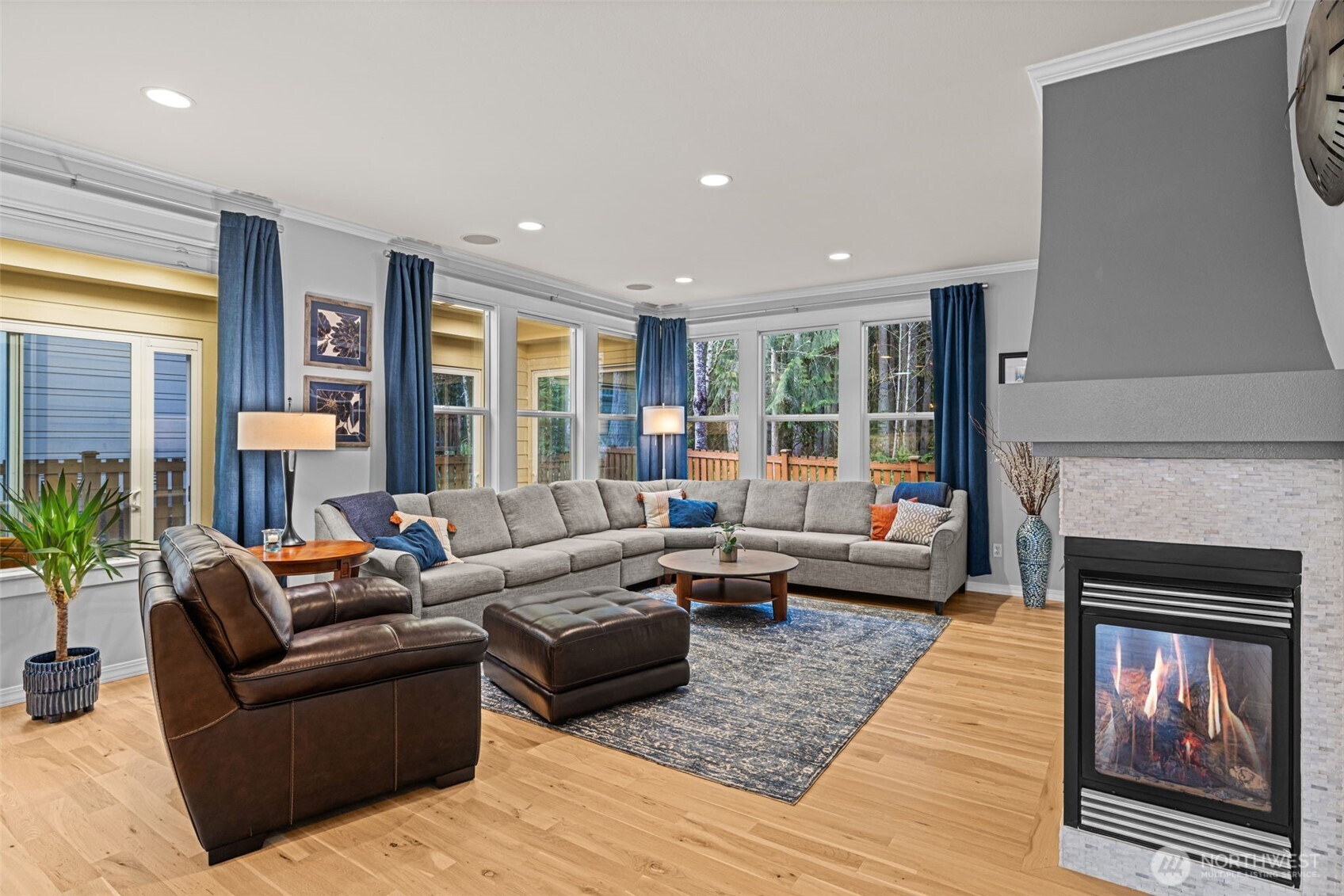 12735 Sun Break Way Northeast Redmond, WA 98053 - Photo 6 of 37 a living room with furniture and a fireplace