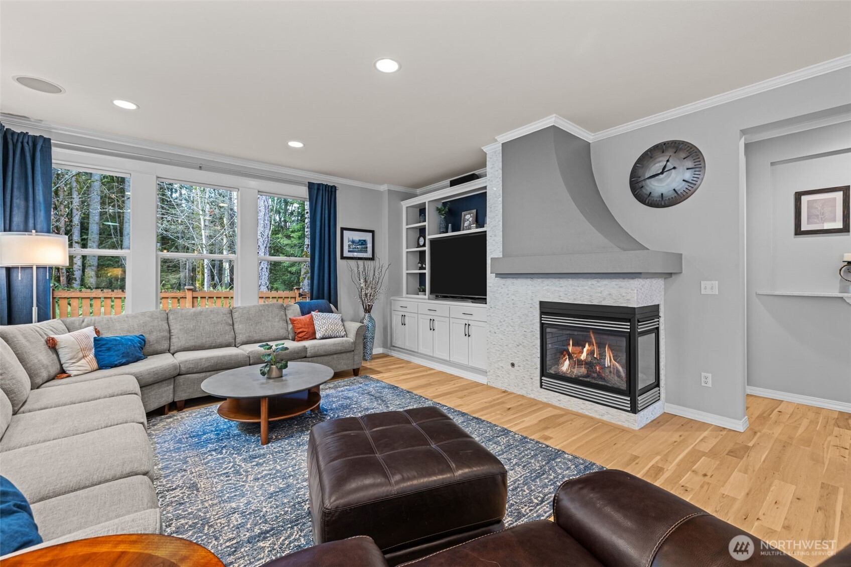 12735 Sun Break Way Northeast Redmond, WA 98053 - Photo 7 of 37 a living room with furniture and a fireplace