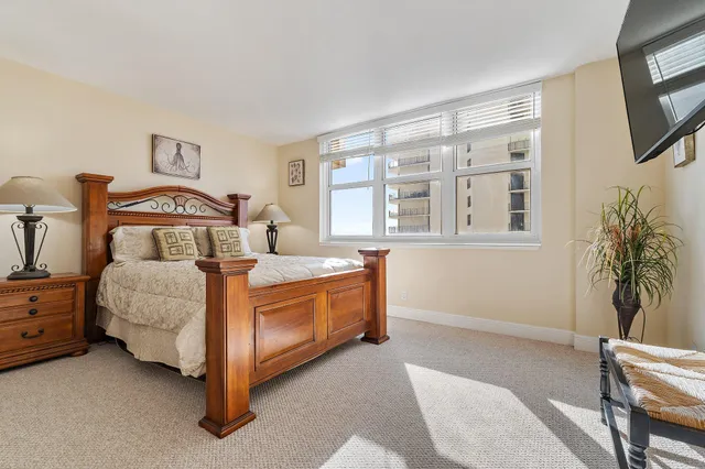 a view of a swimming pool with outdoor seating