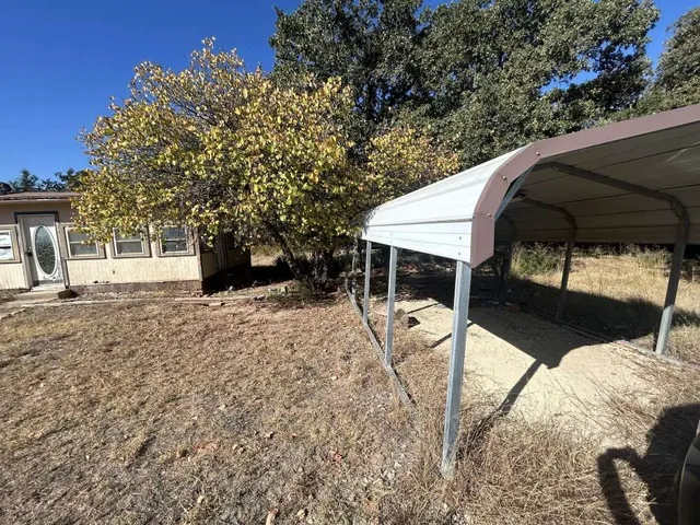 a view of roof with two chairs and a table
