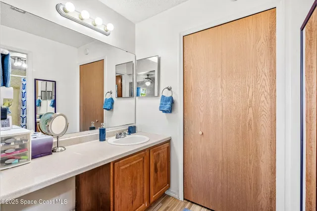 a bathroom with a double vanity sink and a mirror