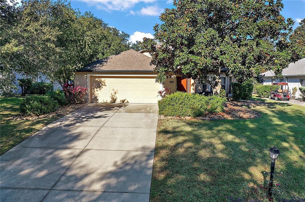 6229 Topsail Road Lady Lake, FL 32159 - Photo 1 of 1 Front Exterior with Mature Landscaping