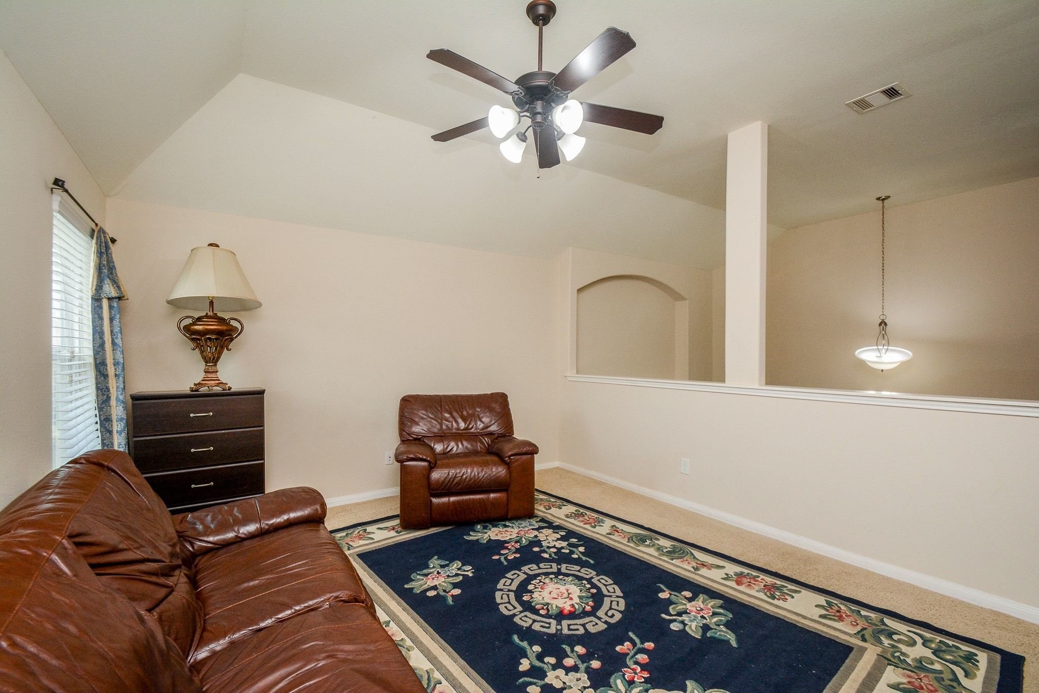 7046 Sliding Rock Circle Spring, TX 77379 - Photo 26 of 41 Charming game room featuring cozy seating, ample natural light, and a stylish ceiling fan—perfect for relaxation and entertainment.