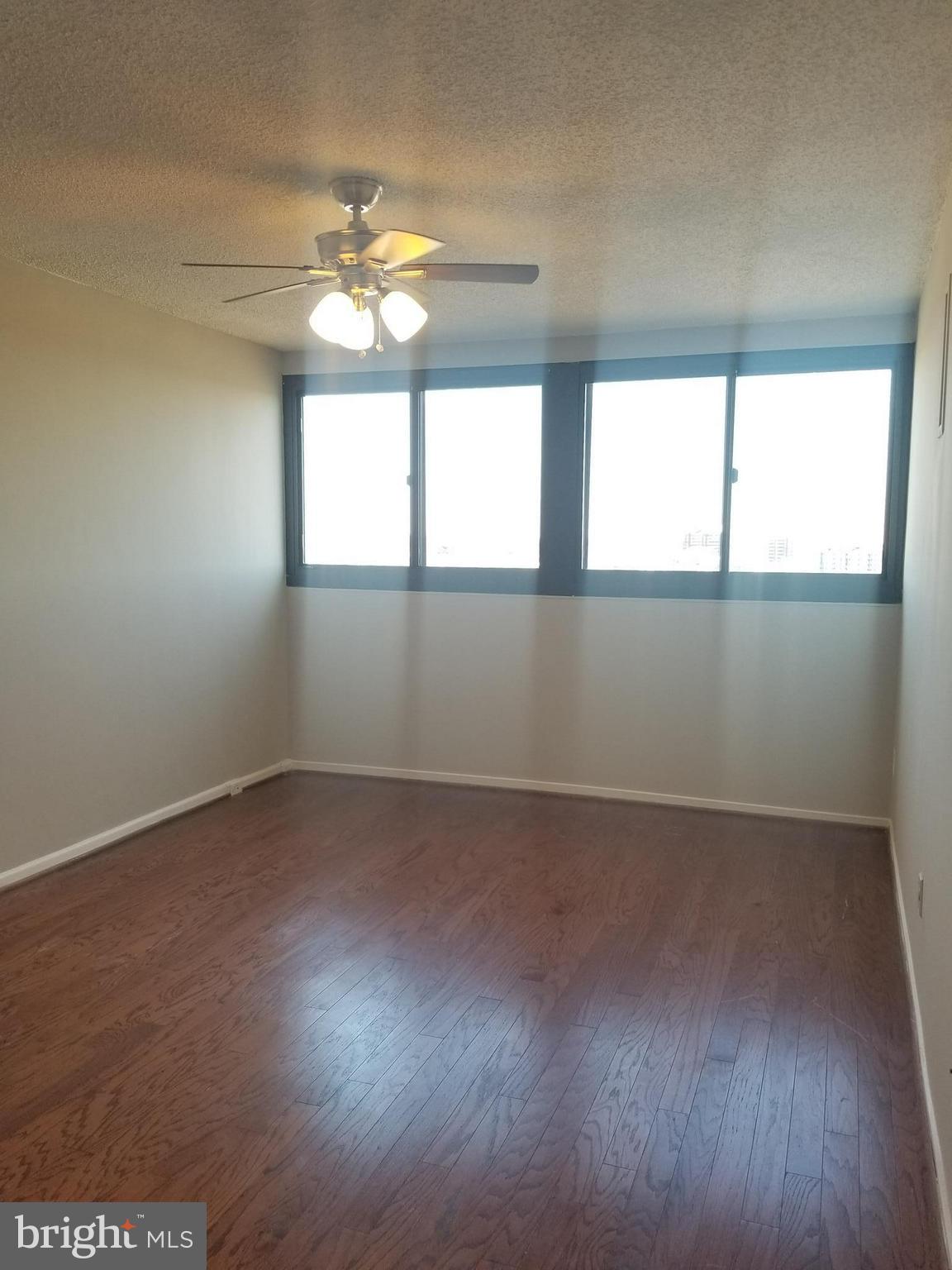 5911 Edsall Road, Unit PH09 Alexandria, VA 22304 - Photo 7 of 14 an empty room with windows