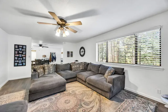 a view of a dining room with furniture and wooden floor