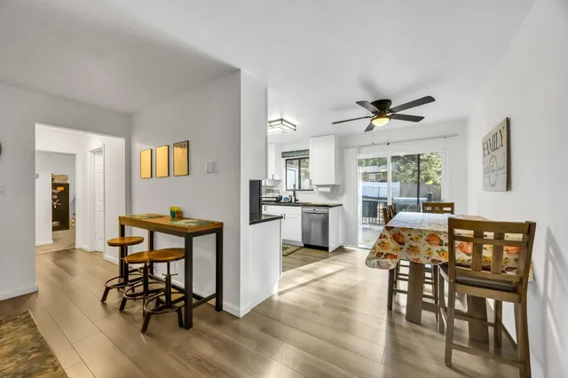 a workspace with wooden floor and a window