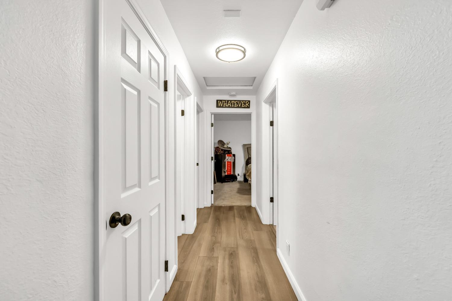 6922 Ridgeway Drive Pollock Pines, CA 95726 - Photo 18 of 44 a view of a hallway with wooden floor and closet