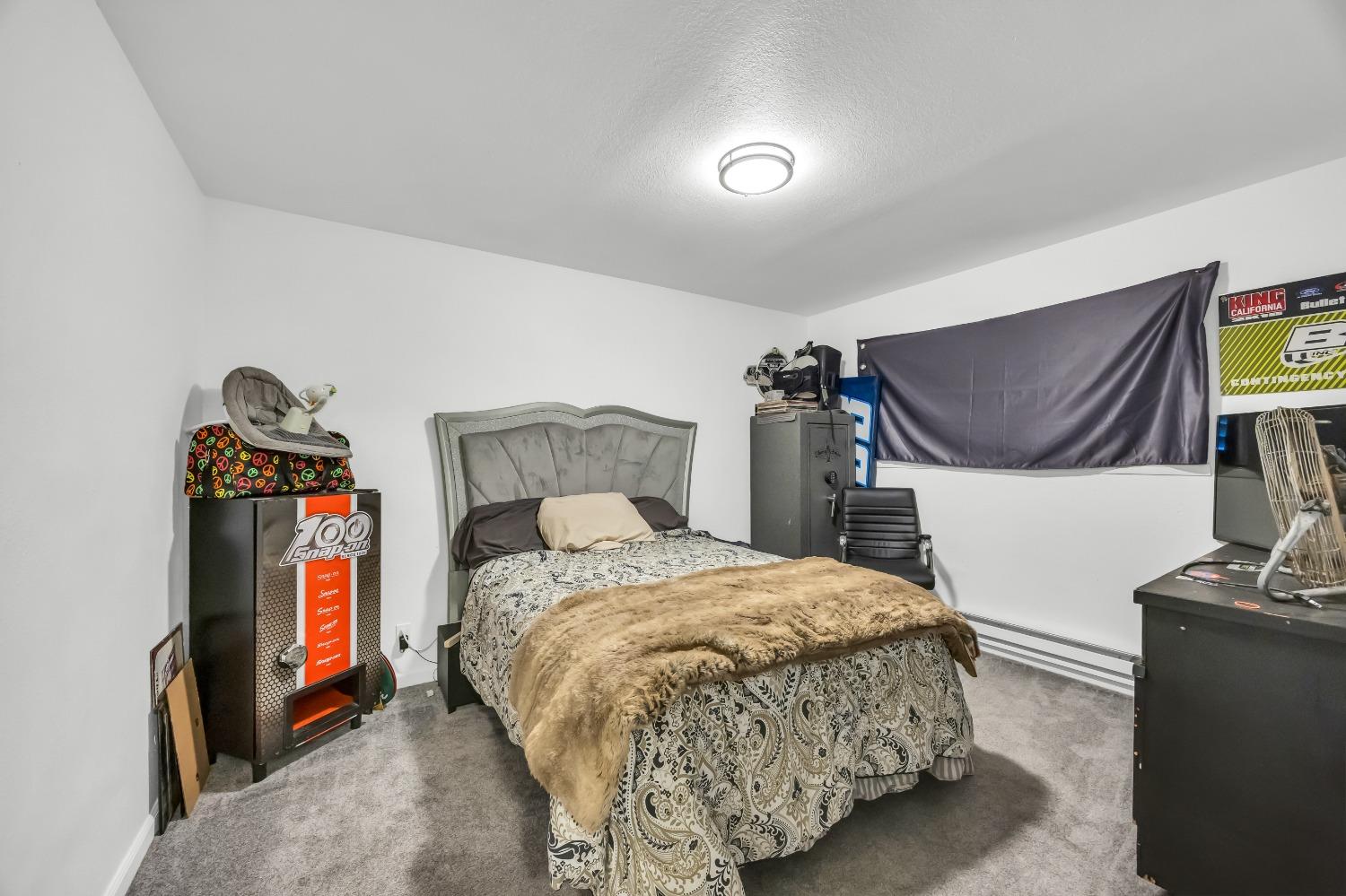 6922 Ridgeway Drive Pollock Pines, CA 95726 - Photo 19 of 44 a bedroom with a bed and a tv on table