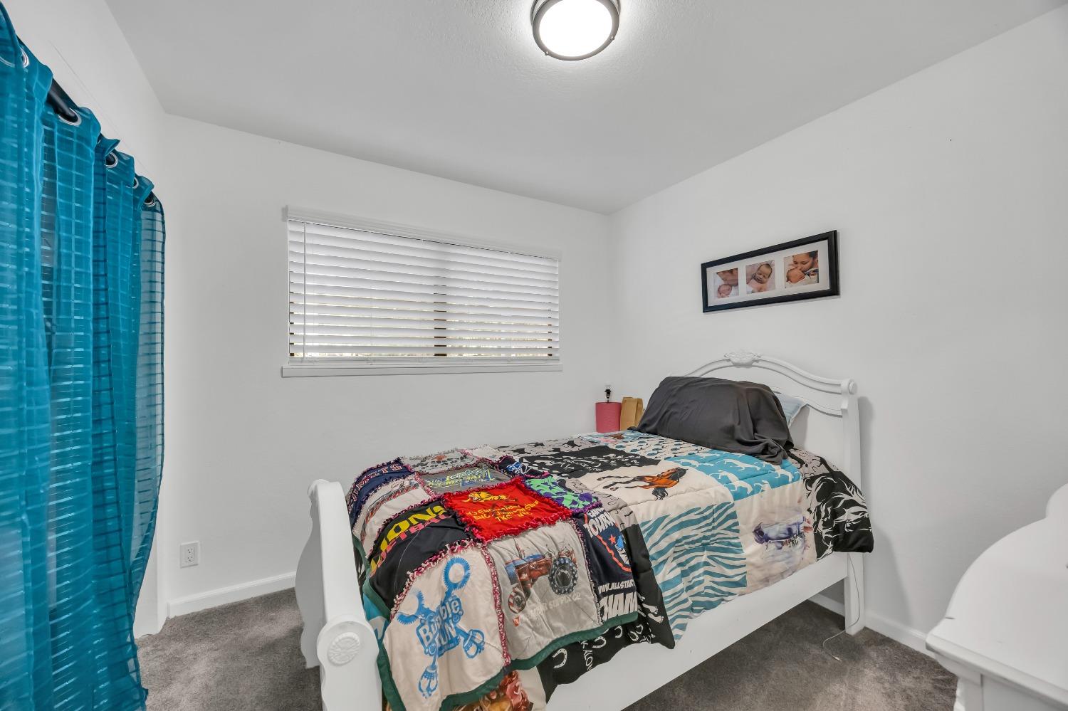 6922 Ridgeway Drive Pollock Pines, CA 95726 - Photo 22 of 44 a bedroom with a bed and a window