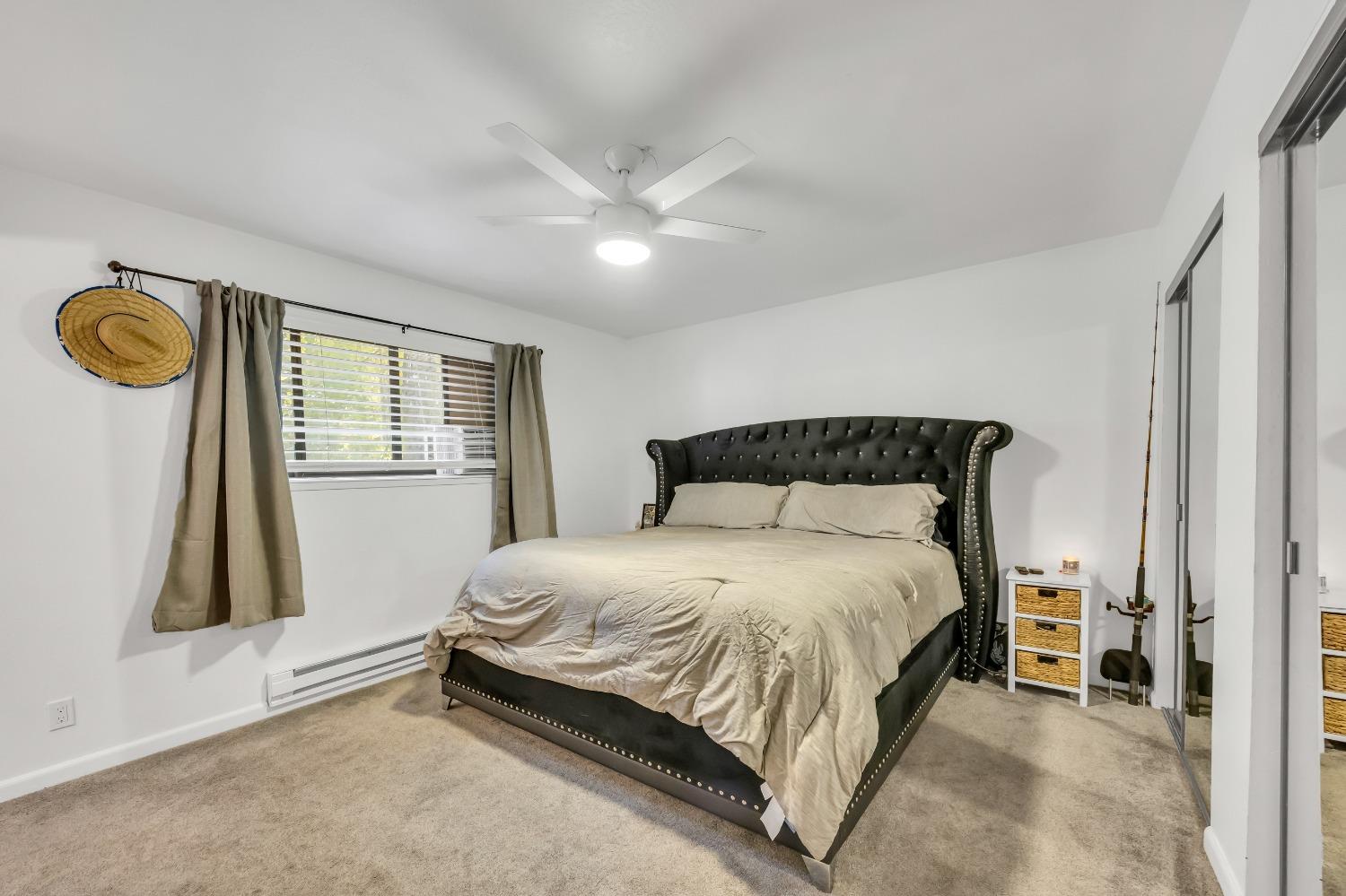 6922 Ridgeway Drive Pollock Pines, CA 95726 - Photo 25 of 44 a bedroom with a bed and a window