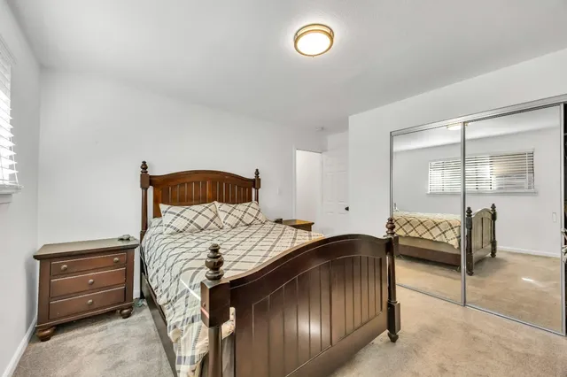 a bedroom with a bed and a television