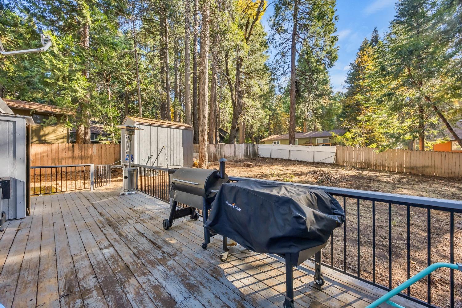 6922 Ridgeway Drive Pollock Pines, CA 95726 - Photo 33 of 44 a view of a deck with chairs and wooden floor