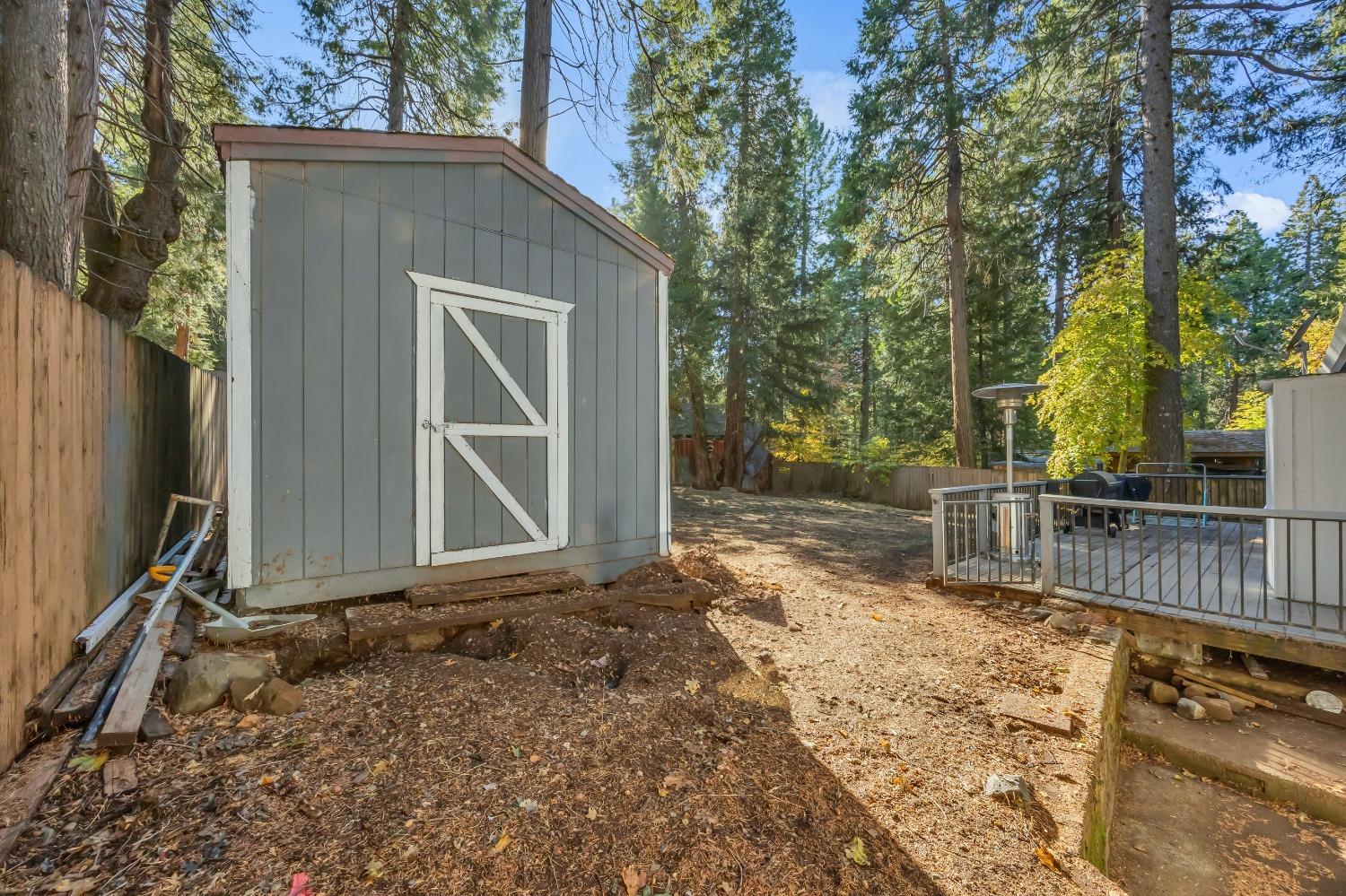 6922 Ridgeway Drive Pollock Pines, CA 95726 - Photo 34 of 44 a view of house with backyard and trees