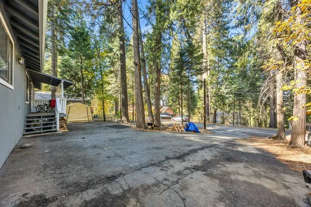 a view of a dining room with furniture and a chandelier