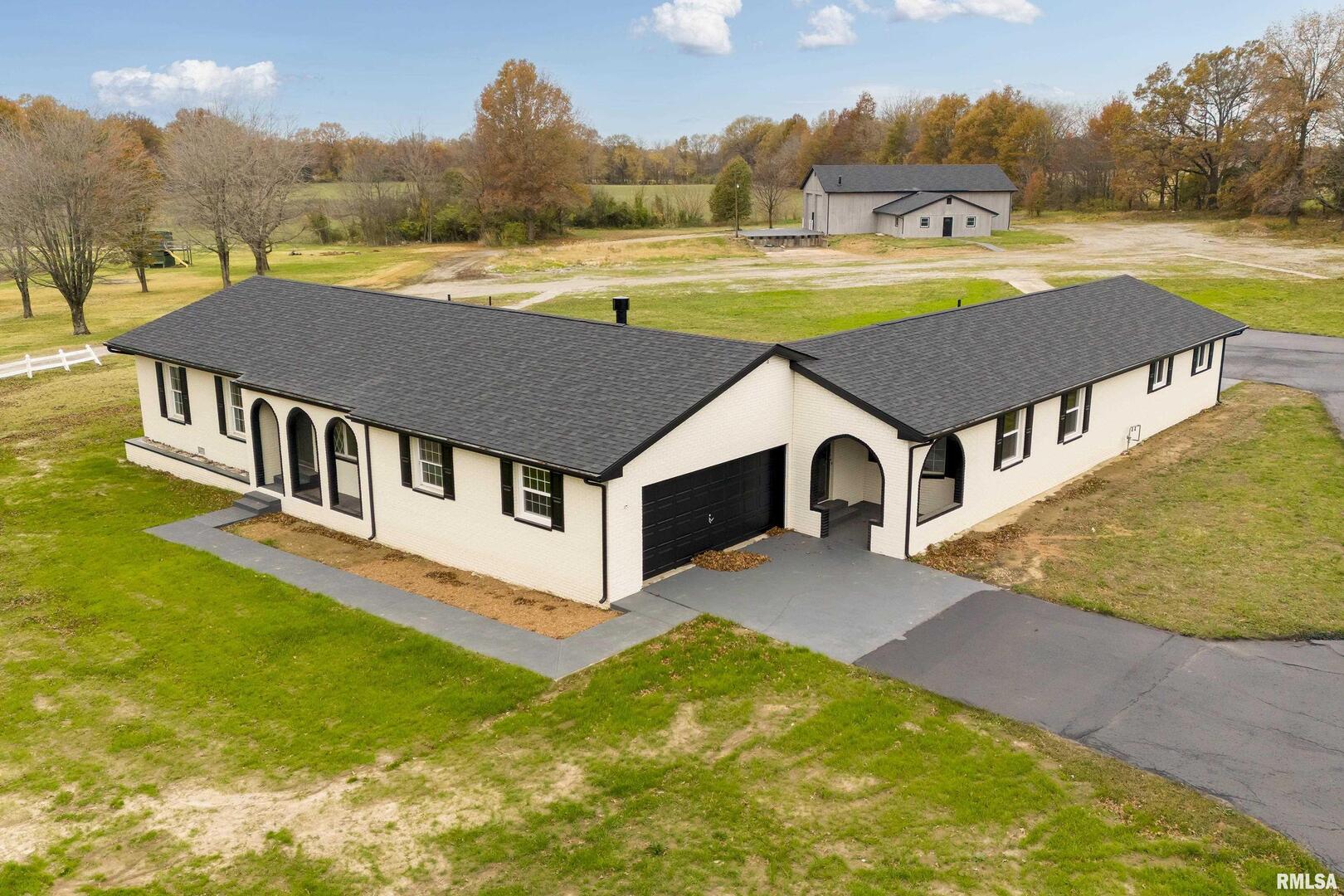 a view of a house with a big yard