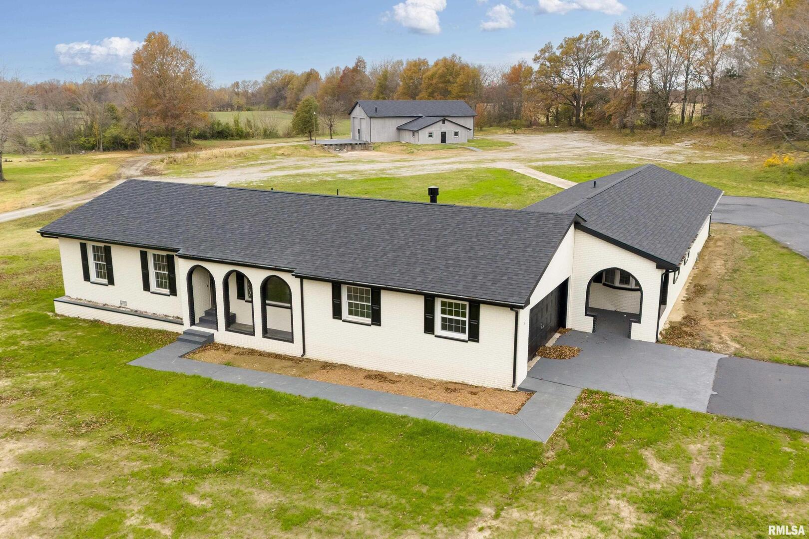 7837 Highway 37 Benton, IL 62812 - Photo 2 of 37 a aerial view of a house with swimming pool and a yard