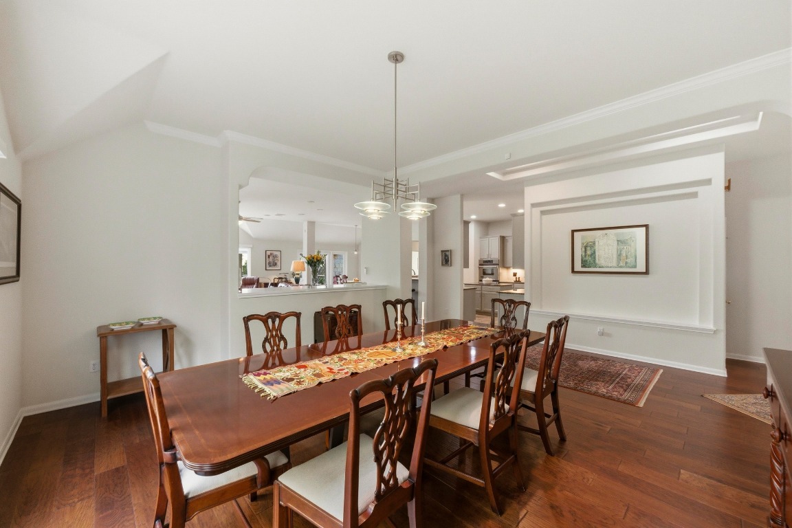 4705 Foster Ranch Road Austin, TX 78735 - Photo 13 of 40 a view of a dining room with furniture window and wooden floor