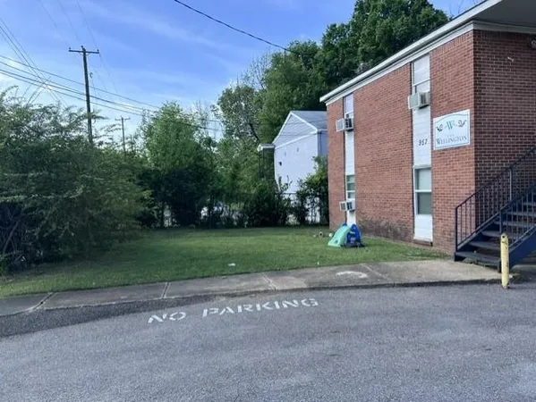 a view of a car park in front of house