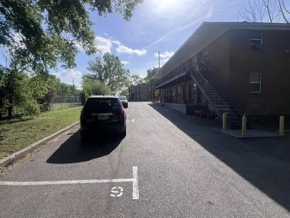 a car parked in front of a house
