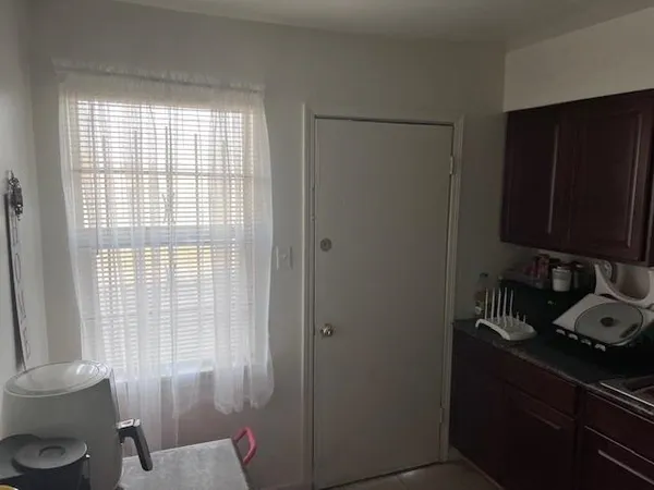 a utility room with sink dryer and washer