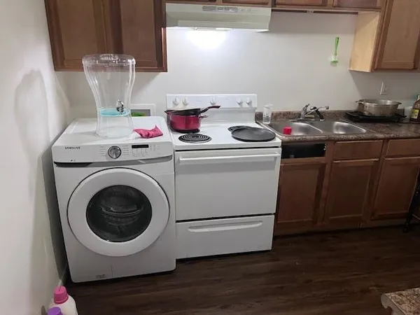 a kitchen with a stove and a microwave