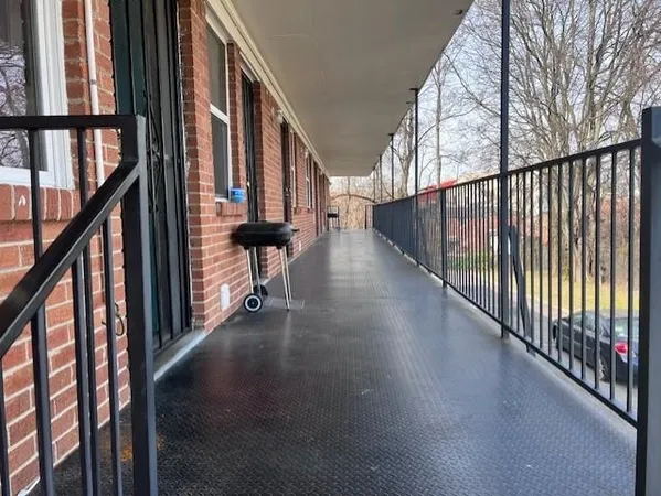 a view of an entryway with wooden floor and stairs