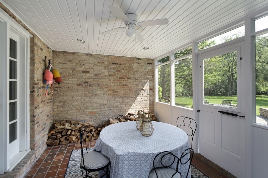 641 Briar Lane Northfield, IL 60093 - Photo 16 of 35 a dining room with furniture and wooden floor
