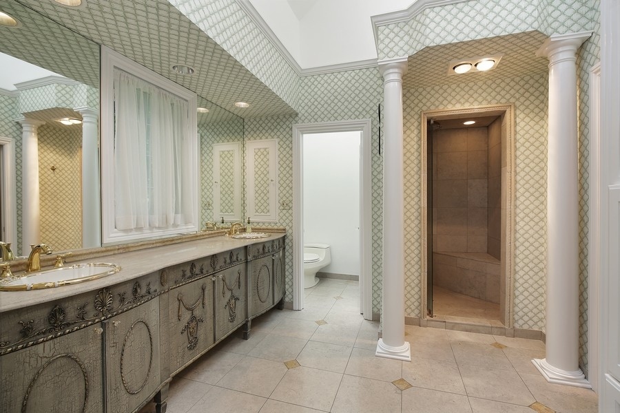 641 Briar Lane Northfield, IL 60093 - Photo 18 of 35 a bathroom with a double vanity sink and mirror