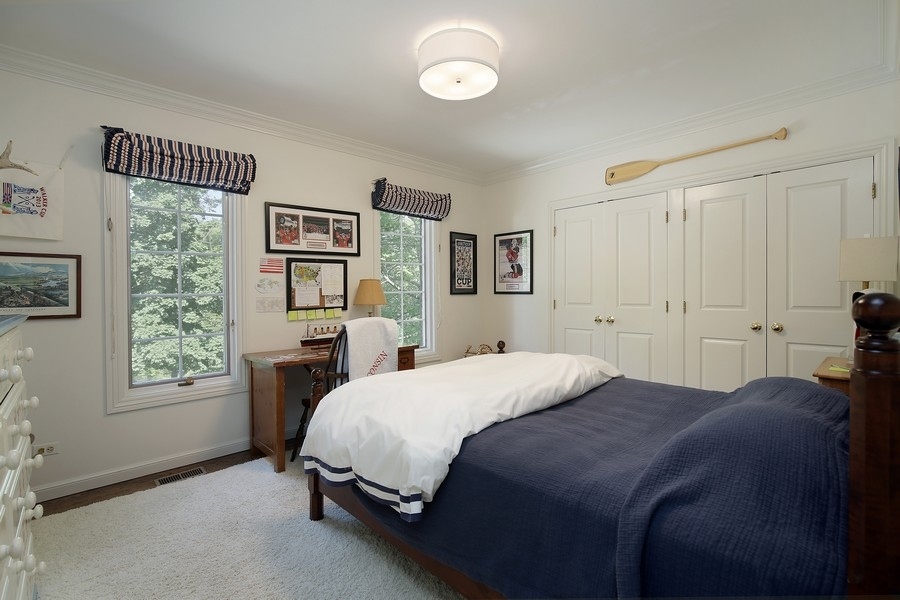 641 Briar Lane Northfield, IL 60093 - Photo 22 of 35 a bedroom with a bed and a window